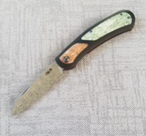 Johan Ellis Lion 4quotDamasteel with Giraffe Bone inlays and Paper Micarta Frame over G10 and titanium