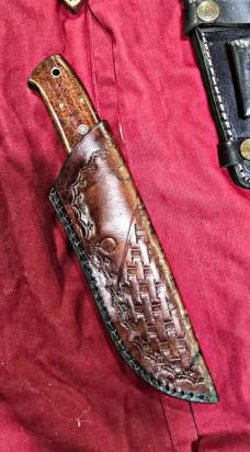 Chisel hand engraved FULL TANG construction kiife. Rosewood handle. Tooled leather sheath