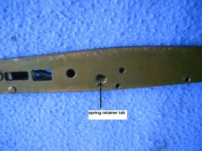 The integrated spring retainer tab is folded in to hold the spring in place.JPG