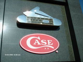 case canoe sign on top of the case store/museum.