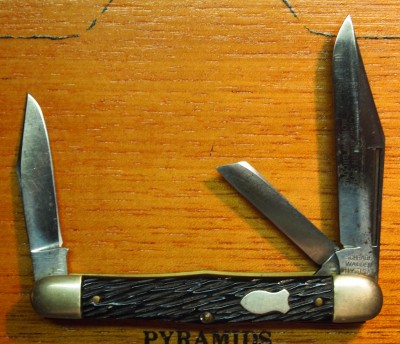 Does this count? There's a light etch on the blade that says "Craftsman" and 9494 and "Hollow Ground"