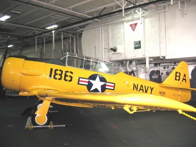 This SNJ is on static  display on the hanger deck of the USS Midway which is currently docked at the Broadway Pier in San Diego as a permanent museum. I checked the Bureau Number of the airplane with my Aviator's Log Book and found I had flown it one time