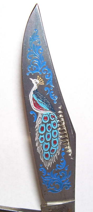 3 blade bulldog trapper peacock.jpg