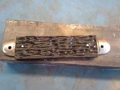 Holes drilled. Pins peened. Handle attached.