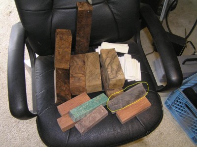 This is a picture of what got everything started, the French Walnut circled in yellow. Also 4 pieces of Claro Walnut 3 more pieces of French Walnut and stabilized green dyed box elder, stabilized Sheoak (3) and a stabilized Maple burl and some camel bone