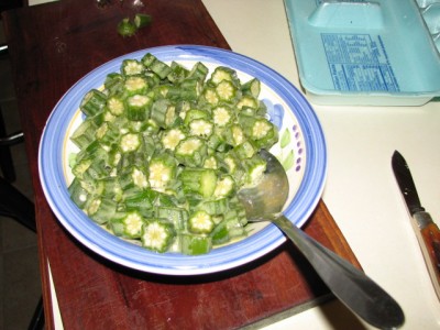 Beat one or two eggs then add the okra slices and stir till all are coated with egg