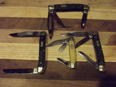 This is a 4-7/8" closed moose and stockman with the 5-1/2 stockman. All three are straight line and Carbon steel.