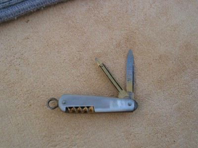 Interesting, old watch fob knife. 1.5" closed. Blade, file, corkscrew &amp; ring are all gold plated. Has June 1899 etched on back-side of the blade.