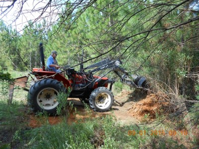 Starting the holding pond and creating a dam on the low side