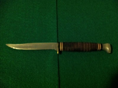 A nice old Kabar fixed blade 1226 with original sheath.