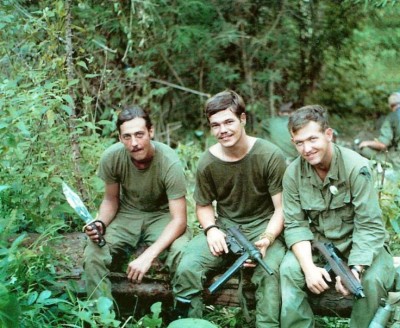 Three soldiers taking a break during a patrol Vietnam date unknown.jpg