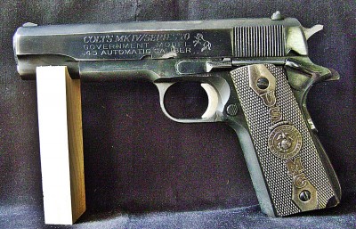 Colt 1911 with USMC Grips.JPG