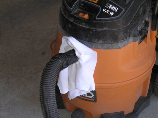 Cloth used as a filter to catch redwood burl dust, my biggest port is at the hose input of the vacuum.