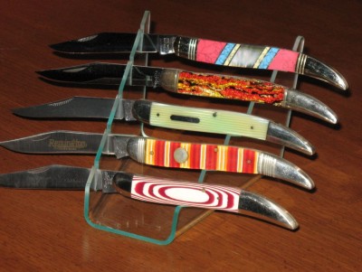 Top to bottom: New Schrade China, Schrade Cut Xmas tree, Bulldog stripe, Remington repro bullet 1988, Jim Frost Micarta handle.