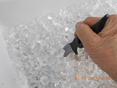 breaking up the refrozen ice to retrieve a venison ham