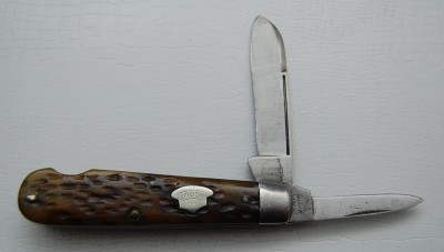 Remington UMC Circle #963, Brown Bone Covers, 3 1/2” closed<br />Correct sheepfoot blade is 95% full with some slight sharpening marks, nickel silver bolster<br />Trooper Hat “Scout” shield and a full pen blade make this easy opener a winner!