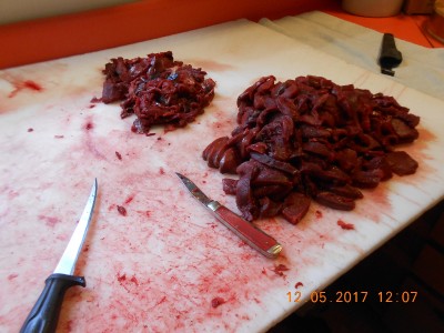 DSCN4094.JPG (897.79 KiB) Viewed 4858 times RR standing by after filet knife did its work. Bigger pile is sliced about 1/4" for frying, the small pile is the beginning of sausage