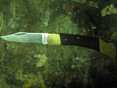 Opened.  Good snap still, some blade wear and of course the reckless sharpening marks are all my fault.  No plans to buff them out as I'd probably lose the etch in the process.