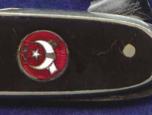 A cloisonne' style Shriner's shield.