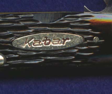 A KaBar shield on a KaBar marked four blade scout-utility, but made by Robeson.
