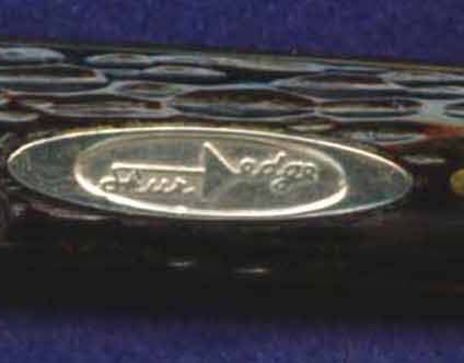 This modern art deco style ShurEdge shield was used during the late 1950's and early 1960's.