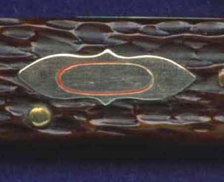 Robeson used this shield on some stock knives with a belt punch blade. This shield will also be found with the letters,<br /> "B P" on it.