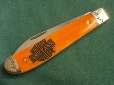 2014 Case 6107W Smooth Orange Bone Wharncliffe Mini Trapper <br />With Harley Davidson Logo Handle Etch and Barbed Wire Bolster Etch