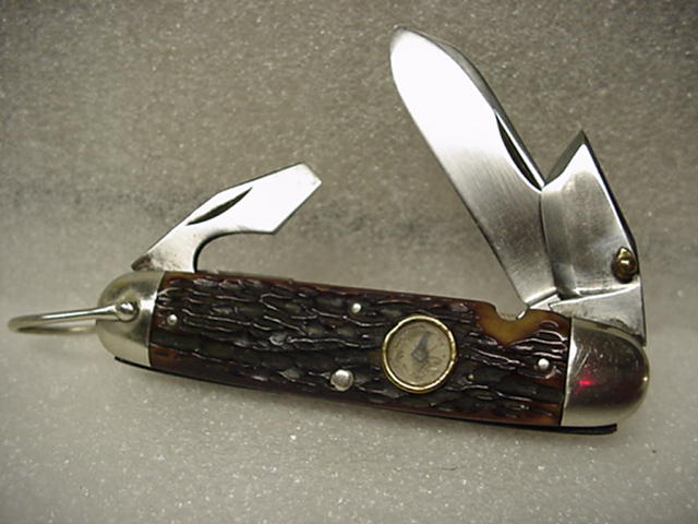 Cattaraugus Cut. Co., 4-bld., Bone, Non Official, Compass inset in handle.