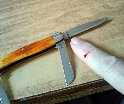 Case 2008 Stockman Pocket Worn Harvest Orange - Bit me.jpg