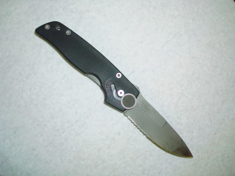 This is a Camillus Cuda.  As a lefty, I find very few knives made as dedicated left hand models.  This was also made in a right hand configuration.  To open the knife, push the disk forward and the blade swings out.  Use your left thumb on the liner lock to close the knife.