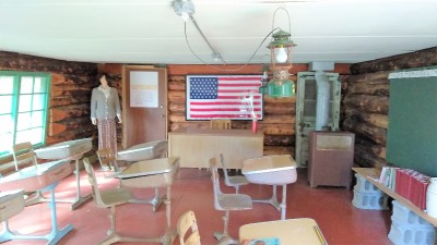 The schoolroom and yes a flag with 49 stars, donated later after Alaska became a state.