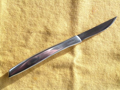 This is an earmark as it is stamped as a 1947 knife. If you will note the squared off look of the handle has been continued to here.