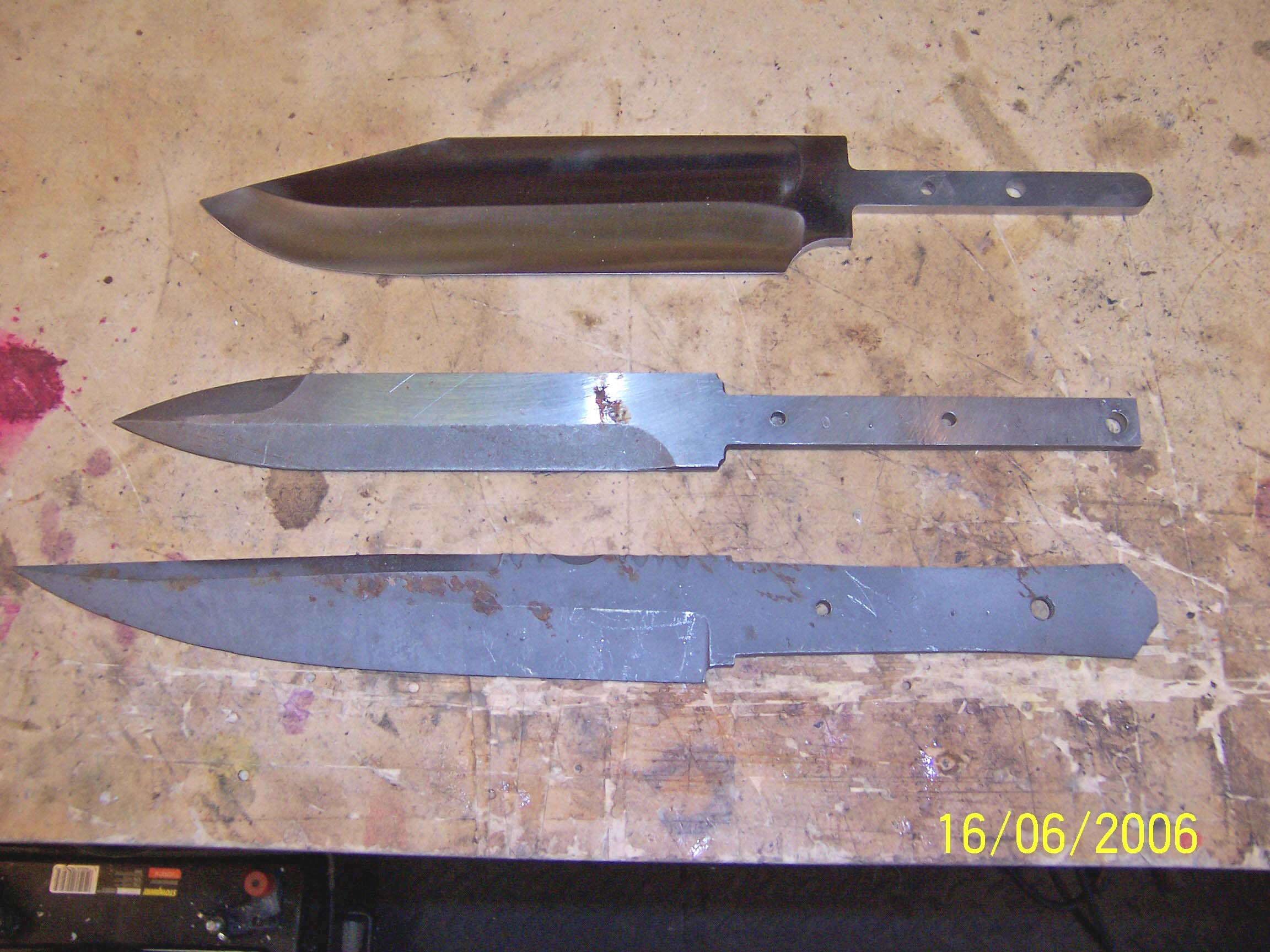 Here are the three blanks that came from the Schrade factory.  I believe I had already buffed the Bowie blank in this picture.  Note the rough surface &amp; the surface rust on the two bottom blanks.