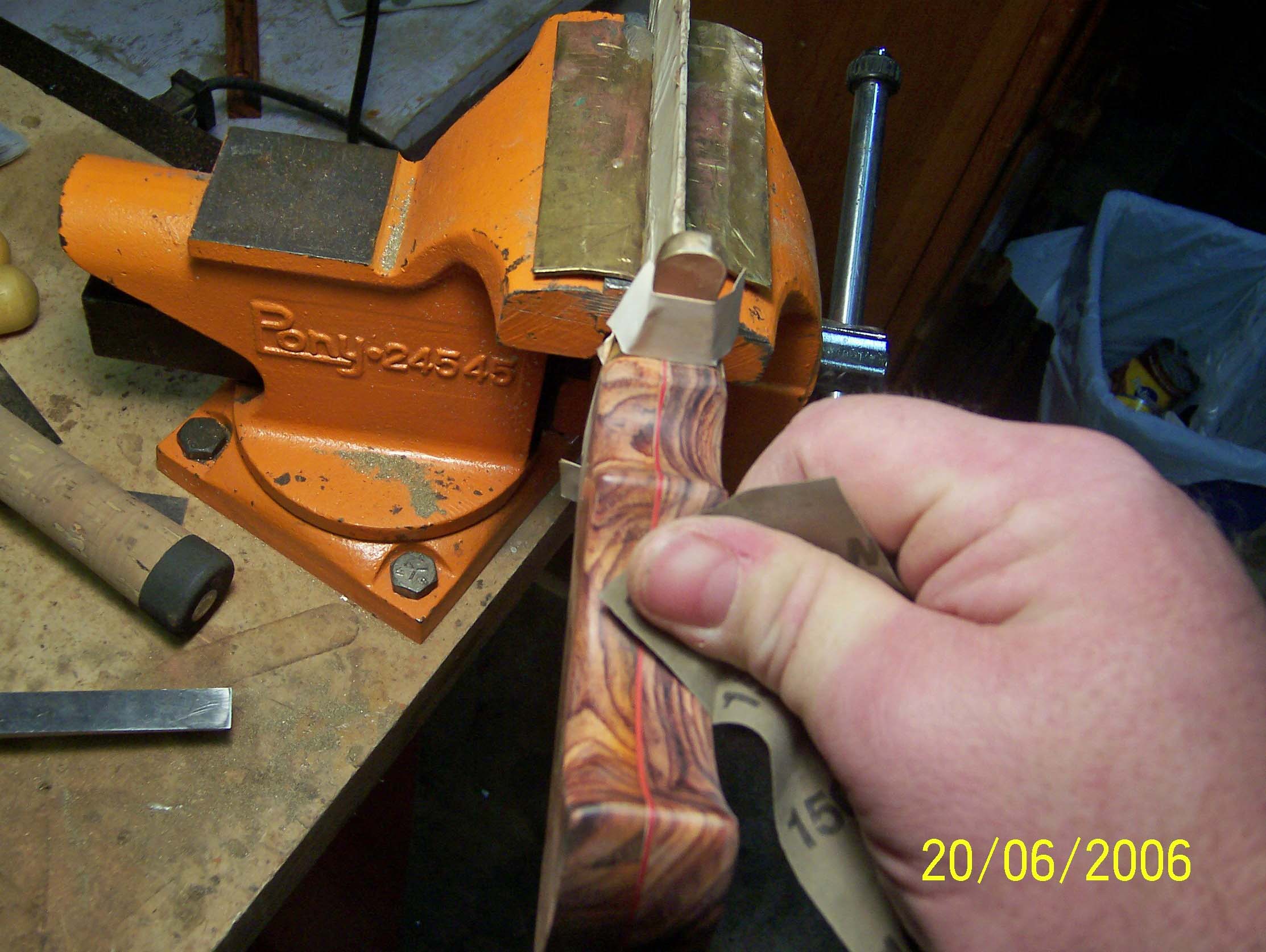 Cocobolo is interesting wood to work with.  It has so much natural oil in it that it is very difficult to get it to take a finish.  I sanded the handles was very fine paper, all the way to 2000 grit.  This puts a very nice finish on the wood even without