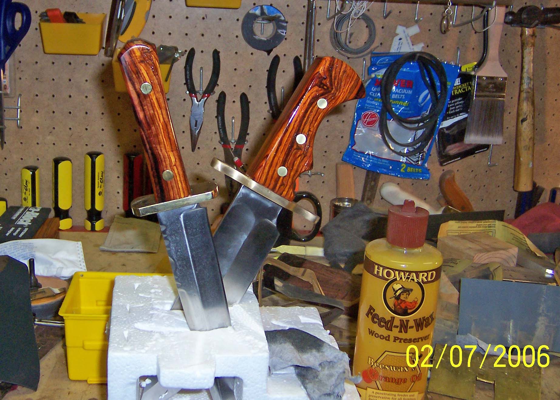 Here is a picture of two of the handles after applying a coat of Howard's Feed and Wax.  This is a mixture beeswax, carnuba wax &amp; orange oil.  This is the only finish I used on these handles other than a final buff of carnuba wax.  In this picture is the