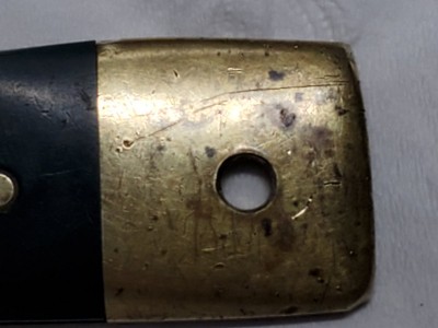 Close up of bolster and pivot hole on name plate handle.