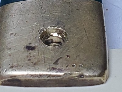 Close up of bolster end and pivot hole on handle without name plate.
