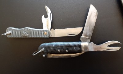The lower "Navy" knife has an old school can opener and no cap lifter, despite the fact that these are post WW2 (I think). Also, the marlin spike on these things are unusually sharp.