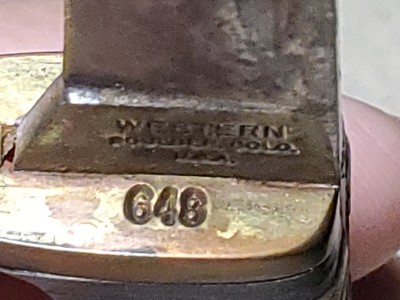 Model 648 stamped on left side of guard