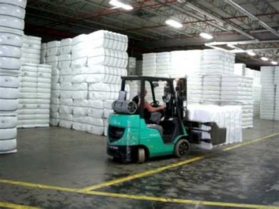 Bales of ginned cotton in warehouse