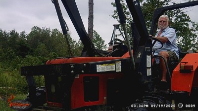 Moving in the loader to raise the feeder