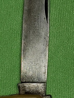 After cleaning, etchings w/two eyes on mark side of blade and eye etching on mark side of tang