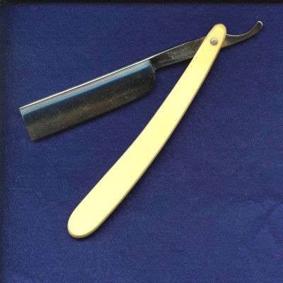 This is a plain white handled razor, but it's a Terrier, 1910-1916.