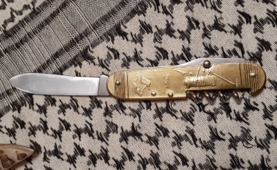 Reverse of the same Coursolle, with a dockside scene. The other piece is a bottle opener.