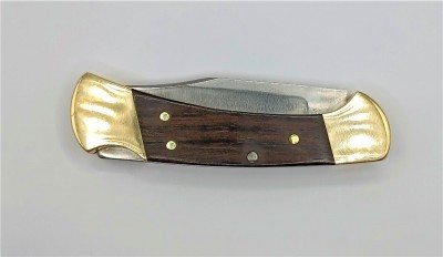 Model ×112×× Ebony wood handle w/Brass bolsters. 1980-1981