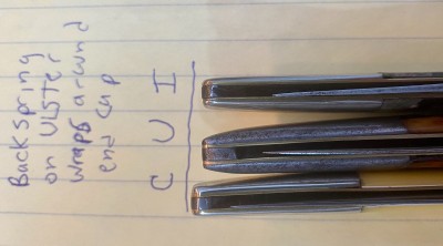 Ulster back spring (center) wraps around end cap. Case (Left) and Imperial (right) don't