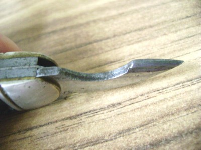 See how the Utica opener was just punched out and the camming surface is square?