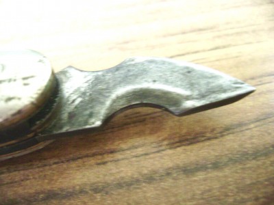 See how they've put a radius on the camming surface of the Camillus opener?