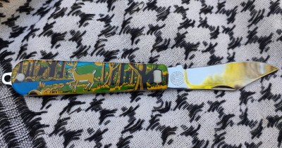 2.30 inch blade, approx. Clear plastic scales with a deer and forest scene on the handle.