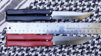 Two Finnish Hackman butterfly knives with solid nylon handles. The black one has a more pronounced clip point blade. These are early production ones (ca. late 1960s IIRC) with the rather small text inside the logo. Later ones had larger, more legible text with the logo next to it.